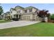 Spacious home featuring a three-car garage and expansive driveway at 2921 Terra View Sw Dr, Lilburn, GA 30047
