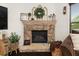Stone fireplace with a decorative mantle that adds rustic charm to the living space at 2921 Terra View Sw Dr, Lilburn, GA 30047