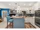 Open kitchen with granite countertops, stainless steel appliances, and island with breakfast bar at 2921 Terra View Sw Dr, Lilburn, GA 30047