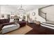 Spacious living room with open floor plan, fireplace, and staircase at 2921 Terra View Sw Dr, Lilburn, GA 30047