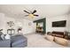 Spacious living room featuring a TV, comfortable seating, and bright white walls at 2921 Terra View Sw Dr, Lilburn, GA 30047