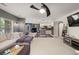 Spacious living room with open floor plan, leading to a modern kitchen and dining area at 2921 Terra View Sw Dr, Lilburn, GA 30047