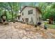 Backyard features a stone patio with outdoor seating, a brick fireplace and a playset at 3252 Custer Lake Drive Northwest Nw Dr, Marietta, GA 30064