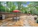 Large backyard stone patio featuring a grill, patio furniture and a stone fireplace at 3252 Custer Lake Drive Northwest Nw Dr, Marietta, GA 30064