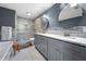 Stylish bathroom featuring double sinks, granite countertops, and marble tiled shower and flooring at 3252 Custer Lake Drive Northwest Nw Dr, Marietta, GA 30064