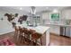 Bright kitchen with white cabinets, stainless appliances, a large island with seating, and a unique world map wall decoration at 3252 Custer Lake Drive Northwest Nw Dr, Marietta, GA 30064