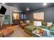 Comfortable living room with modern decor, a plush green sectional, and hardwood floors at 3252 Custer Lake Drive Northwest Nw Dr, Marietta, GA 30064