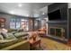 Inviting living room features a brick fireplace, comfortable seating, and backyard access at 3252 Custer Lake Drive Northwest Nw Dr, Marietta, GA 30064