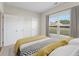 Bright bedroom features a window view and double door closet at 54 Colonial Ter, Villa Rica, GA 30180