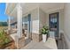 Inviting front porch with brick accents and decorative plants at 54 Colonial Ter, Villa Rica, GA 30180