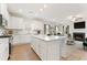 Bright kitchen with a large island, stainless appliances and an open floor plan at 54 Colonial Ter, Villa Rica, GA 30180
