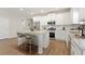 Kitchen featuring white cabinets, stainless appliances, and an island with seating at 54 Colonial Ter, Villa Rica, GA 30180