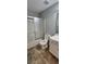Bathroom featuring a shower, toilet, vanity, and patterned tile floor at 1230 Chris Lake Dr, Lawrenceville, GA 30046