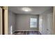 Another bedroom featuring neutral paint, wood floors, and ample closet space at 1230 Chris Lake Dr, Lawrenceville, GA 30046