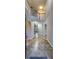 Grand foyer with arched doorways, recessed lighting, and a staircase leading to the second floor at 1230 Chris Lake Dr, Lawrenceville, GA 30046