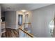 Upstairs hallway with hardwood floors and neutral paint at 1230 Chris Lake Dr, Lawrenceville, GA 30046