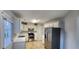 Well-lit kitchen features stainless steel appliances, gas range, and white cabinets at 1230 Chris Lake Dr, Lawrenceville, GA 30046