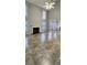 Bright and open living room with large windows, a fireplace, and a view of the kitchen at 1230 Chris Lake Dr, Lawrenceville, GA 30046