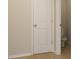 Bathroom with a neutral colored door and toilet at 315 Lakeside Ln, Woodstock, GA 30188