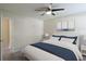 Bright bedroom featuring a ceiling fan and stylish decor above the white headboard bed at 315 Lakeside Ln, Woodstock, GA 30188