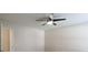 Ceiling fan centered in a room with neutral-colored walls and a bright overhead light at 315 Lakeside Ln, Woodstock, GA 30188