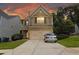 Two-story home with a two-car garage and well-manicured lawn at 315 Lakeside Ln, Woodstock, GA 30188