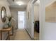 Hallway with decor, a stairway, a laundry room with a washer and dryer, and carpet flooring at 315 Lakeside Ln, Woodstock, GA 30188