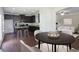 Elegant kitchen dining area with modern dark cabinets and adjacent living space at 315 Lakeside Ln, Woodstock, GA 30188