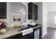 A well-appointed kitchen with granite counters and stainless steel dishwasher at 315 Lakeside Ln, Woodstock, GA 30188