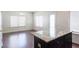 Bright eat-in kitchen featuring granite counters, stainless steel appliances, and hardwood floors at 315 Lakeside Ln, Woodstock, GA 30188