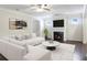Comfortable living room featuring hardwood floors, fireplace, and cozy seating at 315 Lakeside Ln, Woodstock, GA 30188