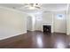 Open concept living room with fireplace and hardwood floors for relaxation at 315 Lakeside Ln, Woodstock, GA 30188