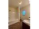 Bathroom featuring tile floors, a bathtub, a shower, and a double sink at 664 Oakside Pl, Acworth, GA 30102