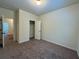 Bedroom features neutral walls, carpet, a closet, and access to other rooms at 664 Oakside Pl, Acworth, GA 30102