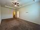 Spacious bedroom featuring a ceiling fan, a window, and neutral walls at 664 Oakside Pl, Acworth, GA 30102