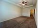 Spacious bedroom with a ceiling fan, window, and neutral walls at 664 Oakside Pl, Acworth, GA 30102