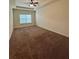 Spacious bedroom features a fan, a window, and neutral walls at 664 Oakside Pl, Acworth, GA 30102