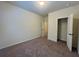 Neutral bedroom features carpet, closet, and access to other rooms at 664 Oakside Pl, Acworth, GA 30102