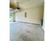 Spacious garage with concrete floors, electric door and mounted lighting at 664 Oakside Pl, Acworth, GA 30102