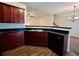 Charming kitchen with dark cabinets, stainless steel sink, and convenient dishwasher at 664 Oakside Pl, Acworth, GA 30102