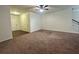 Inviting living room featuring plush carpet, neutral walls, and ample natural light at 664 Oakside Pl, Acworth, GA 30102