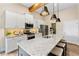 Modern kitchen featuring granite countertops, stainless steel appliances, and ample cabinet space for storage at 81 Heritage Pointe Dr, Villa Rica, GA 30180