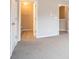 Bedroom with neutral walls and carpet, closet and ensuite access at 2709 Heathrow Dr, Lawrenceville, GA 30043