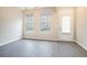 Inviting living room with wood floors and natural light, featuring a front-door entryway at 2709 Heathrow Dr, Lawrenceville, GA 30043