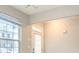 Bright living room with large windows and natural light, plus a view of the front yard at 2709 Heathrow Dr, Lawrenceville, GA 30043