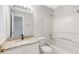 Bright bathroom featuring granite counters, white vanity, and tub with shower in a neutral color palette at 2754 Terrell Trace Dr, Marietta, GA 30067