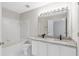 Clean bathroom featuring a double vanity, granite countertop, tile flooring, and tub-shower combo at 2754 Terrell Trace Dr, Marietta, GA 30067