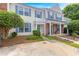 Charming townhome showcasing a well-maintained front exterior, neat landscaping, and a paved driveway at 2754 Terrell Trace Dr, Marietta, GA 30067
