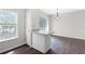 Bright breakfast nook and kitchen area with granite countertops, white cabinetry, and modern lighting fixtures at 2754 Terrell Trace Dr, Marietta, GA 30067