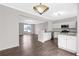 Bright kitchen features white cabinets, stainless steel appliances and an open view into a living room at 2754 Terrell Trace Dr, Marietta, GA 30067
